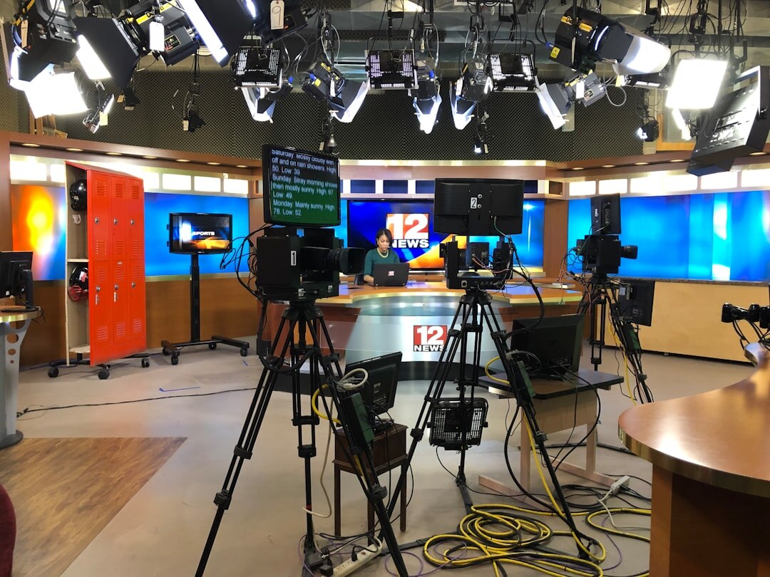 Television broadcast studio set with cameras and lighting rig