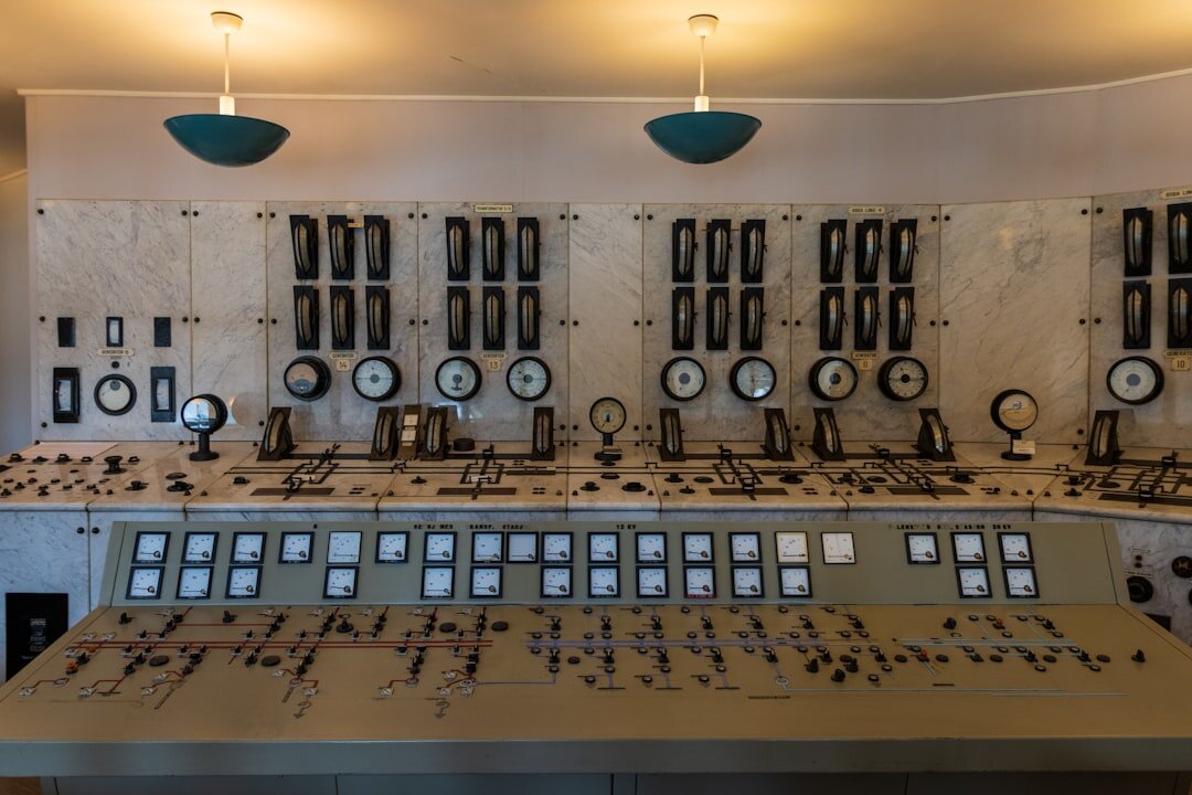 Broadcast control room with rows of monitors showing live feeds